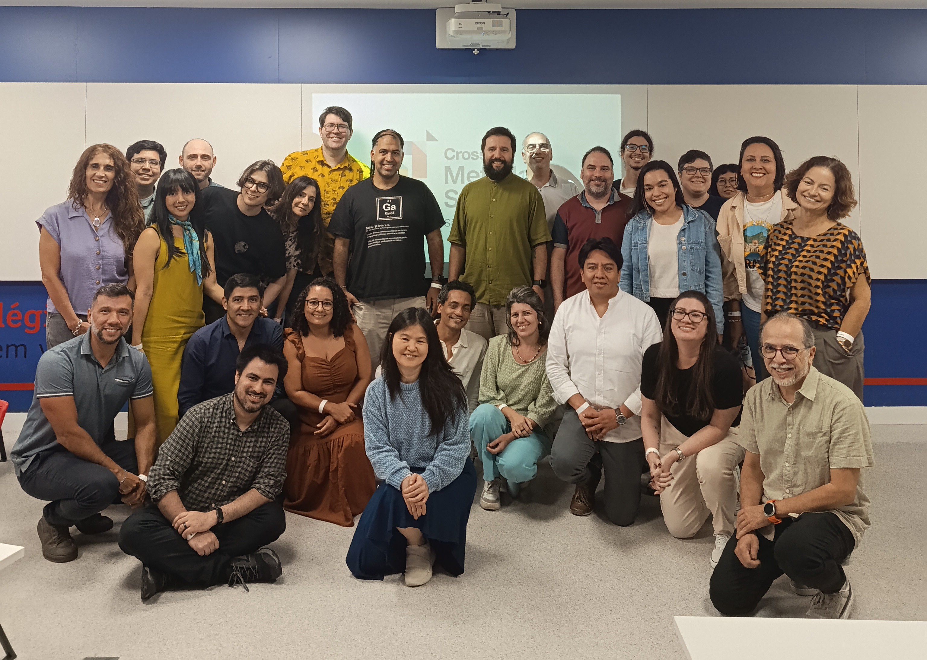 A group of people posing in front of a Metadata Sprint logo